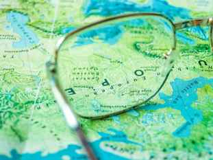 eyeglasses on top of map