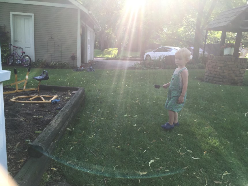 Tom Getsch of Manny carying cup to sandbox